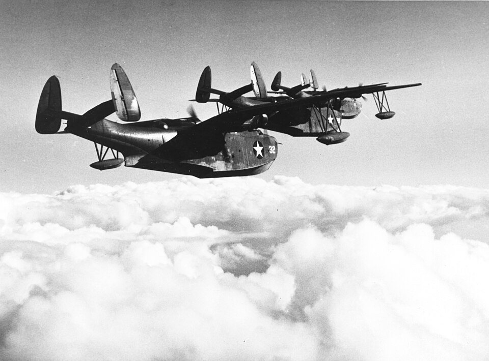 Two PBM Mariner flying boats with gull wings in flight over Florida.