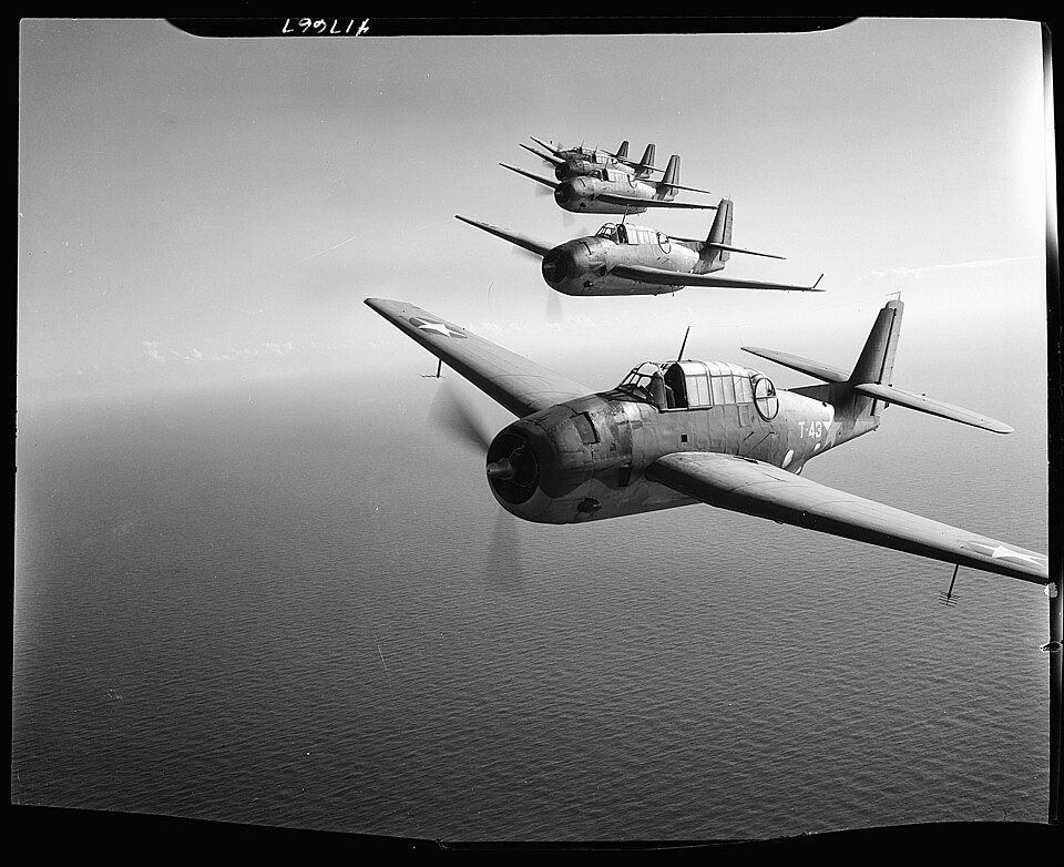 A formation of Navy torpedo bombers flying over the Florida coast in the 1940s.