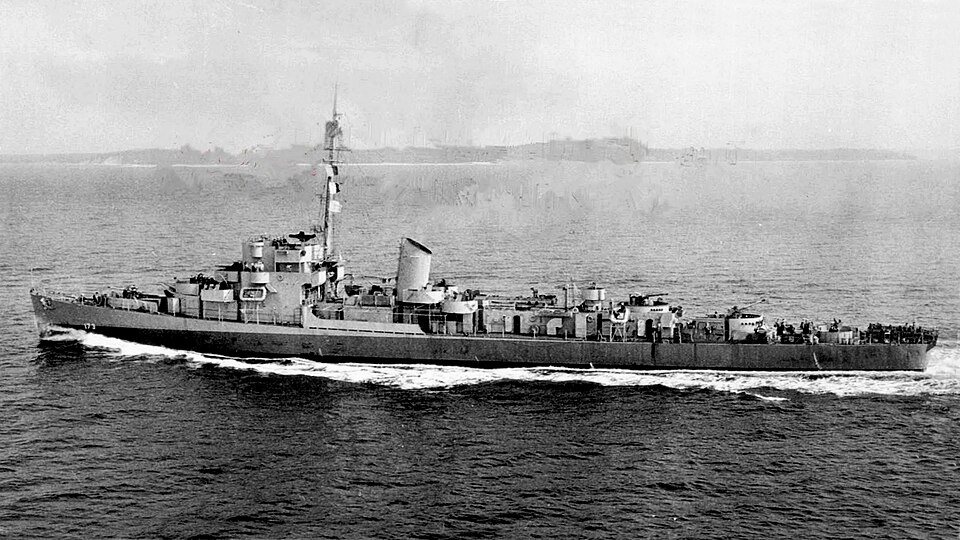 A gray Navy destroyer escort sailing at sea.
